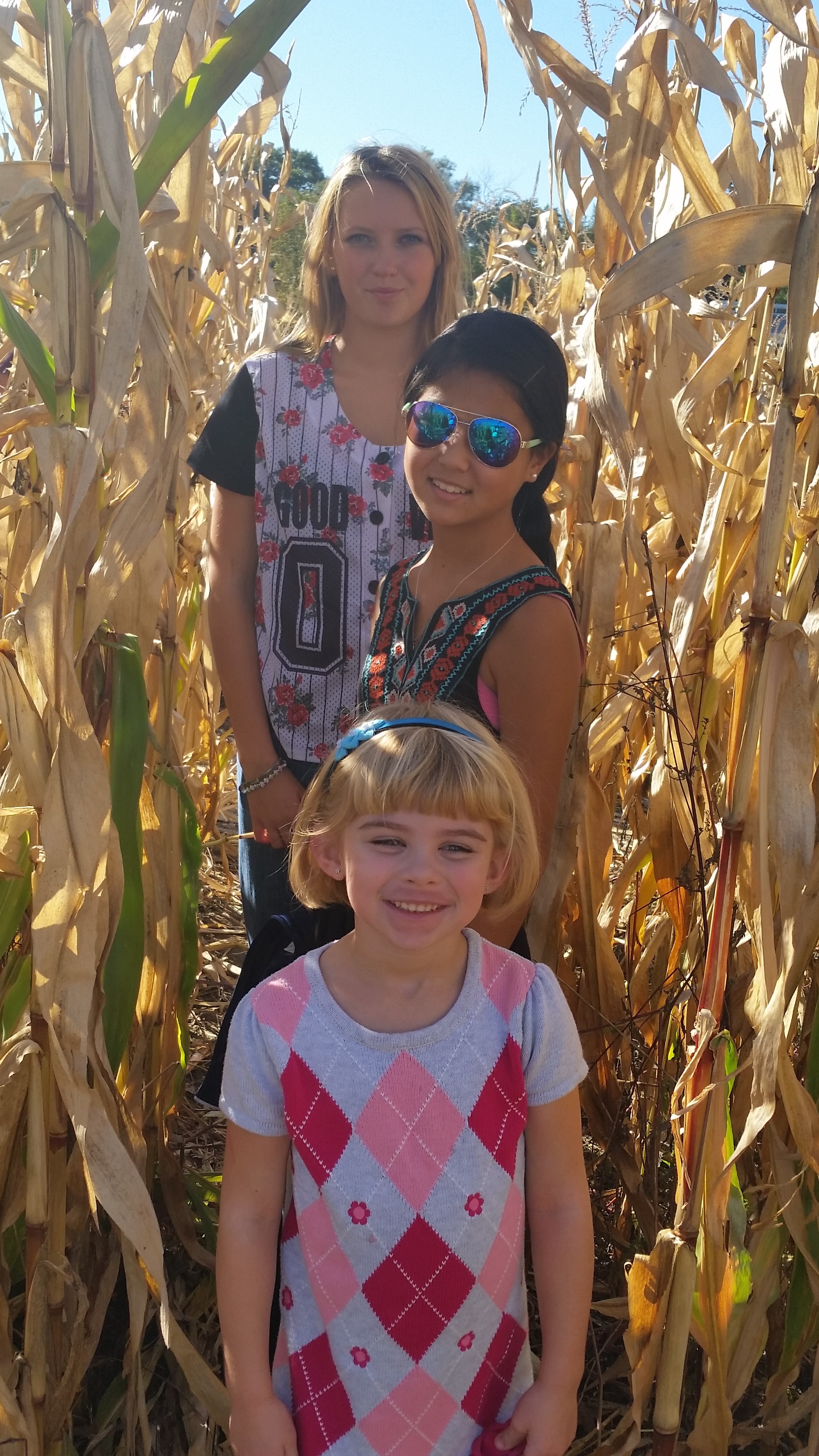 Children's Orchard three older girls in corn maze